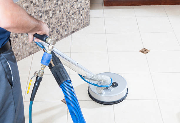 Man cleaning tile